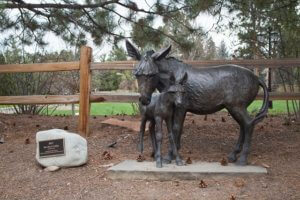 Bronze sculpture of two burros
