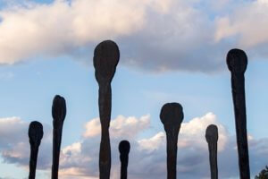 nine stainless steel figures depicting the human presence, removed of age, race, gender, era, and all other characteristics that distinguish it from the whole of nature