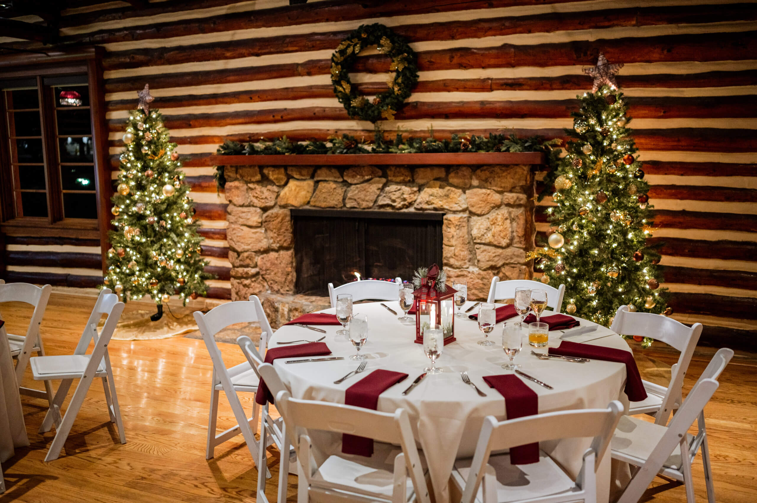 Photo of the Inn at Hudson Gardens with a set table and christmas trees
